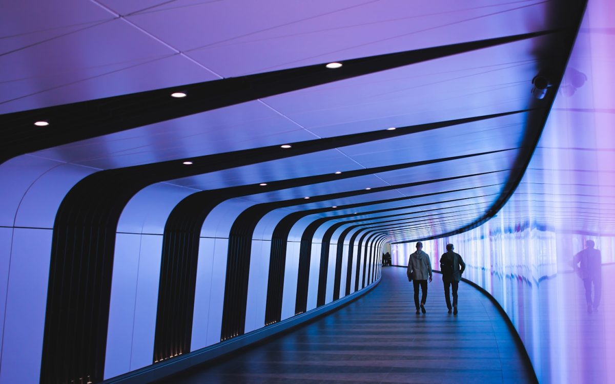 man walking through pathway